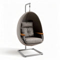 Hanging egg chair with cushion and wooden armrests for indoor or outdoor use